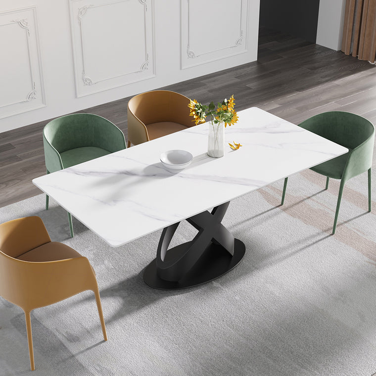 Cavara dining table with a white sintered stone top on a black X shaped base, set with chairs