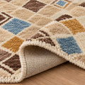 100% Handspun Miamana Wool Rug, folded corner showing the back