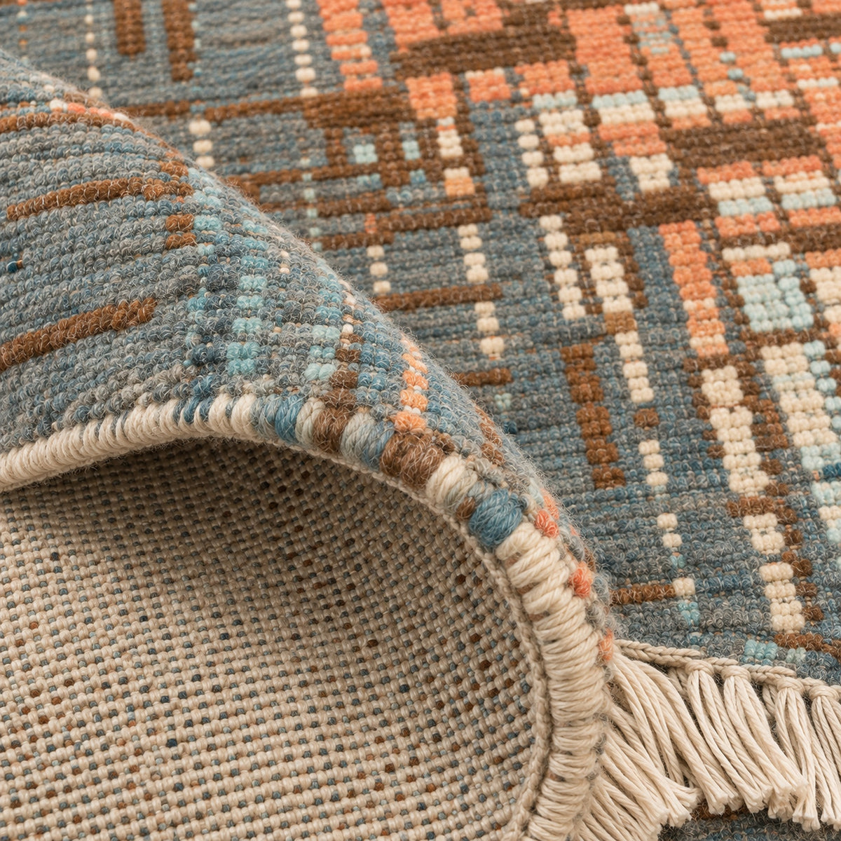 Mystique Grafton Grey Orange Oversized Area Rug For your Home, folded corner showing the back