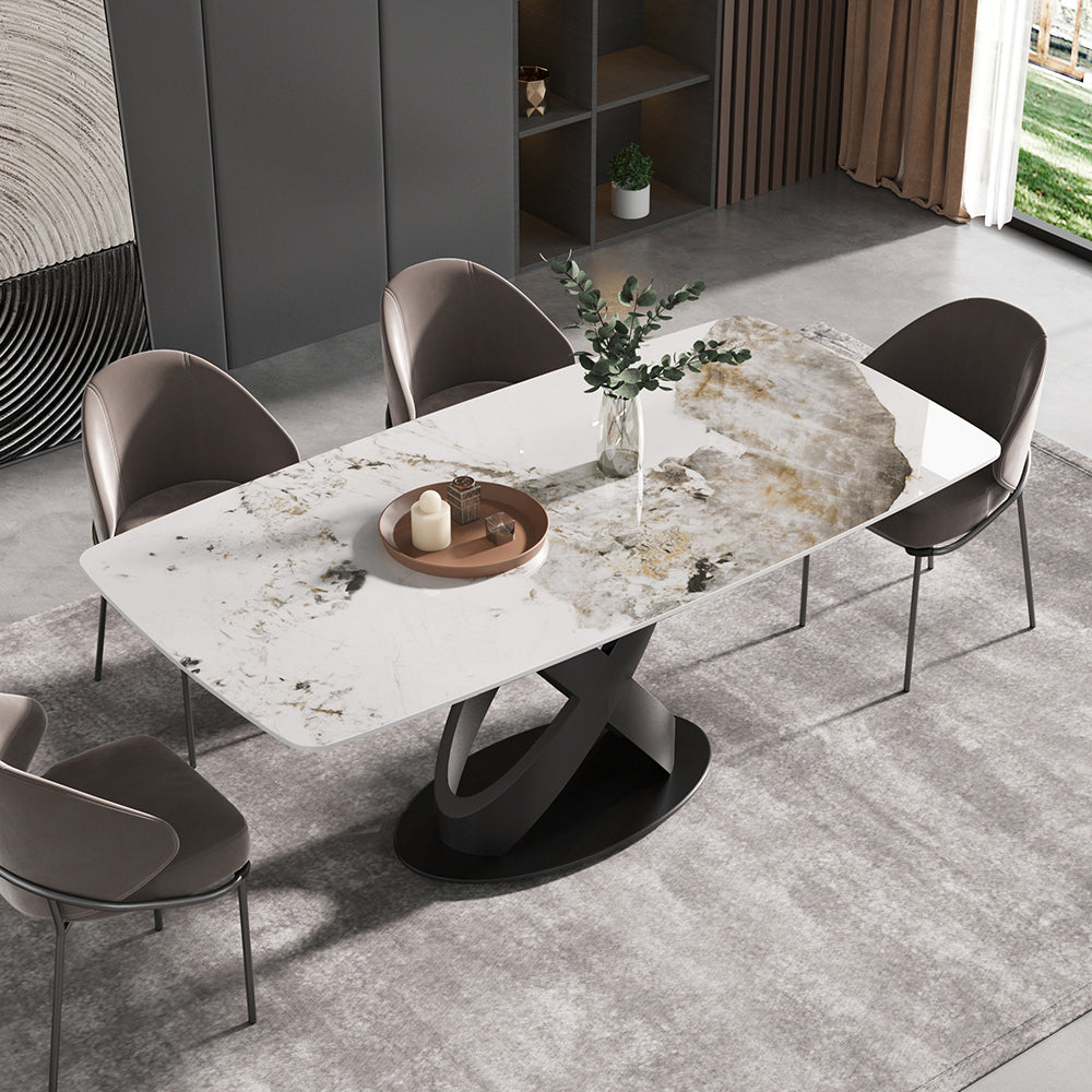Cavara dining table with a white sintered stone top and upholstered chairs