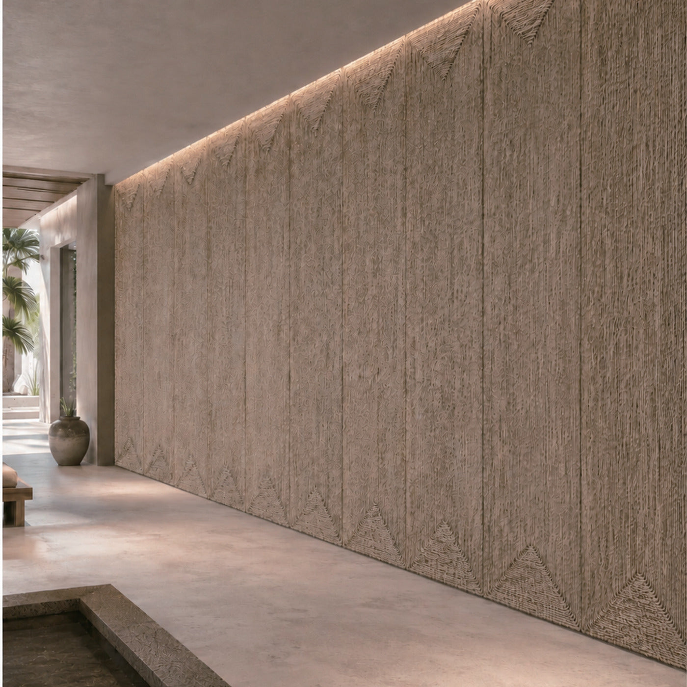 Straw rope wall panels installed side by side across a full feature wall with cove lighting above