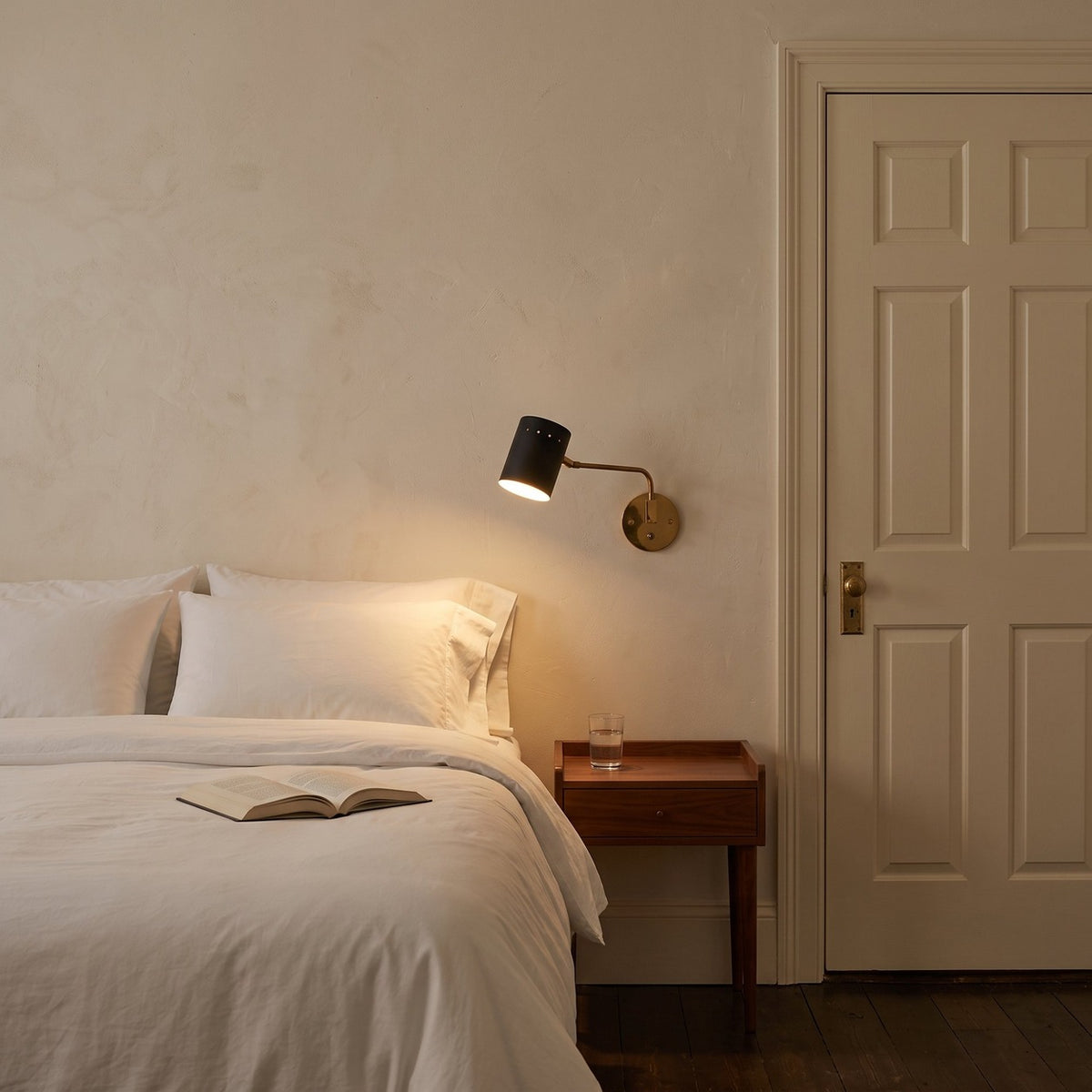 Articulated One-Light Wall Lamp – Mid-Century Modern Brass Sconce in a room