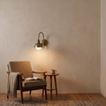 Brass Wall Sconce Light with Dome Shade – Aged Brass Finish in a room
