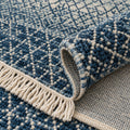 Denim blue Indo Savannah Soft Wool Rug, folded corner showing the back