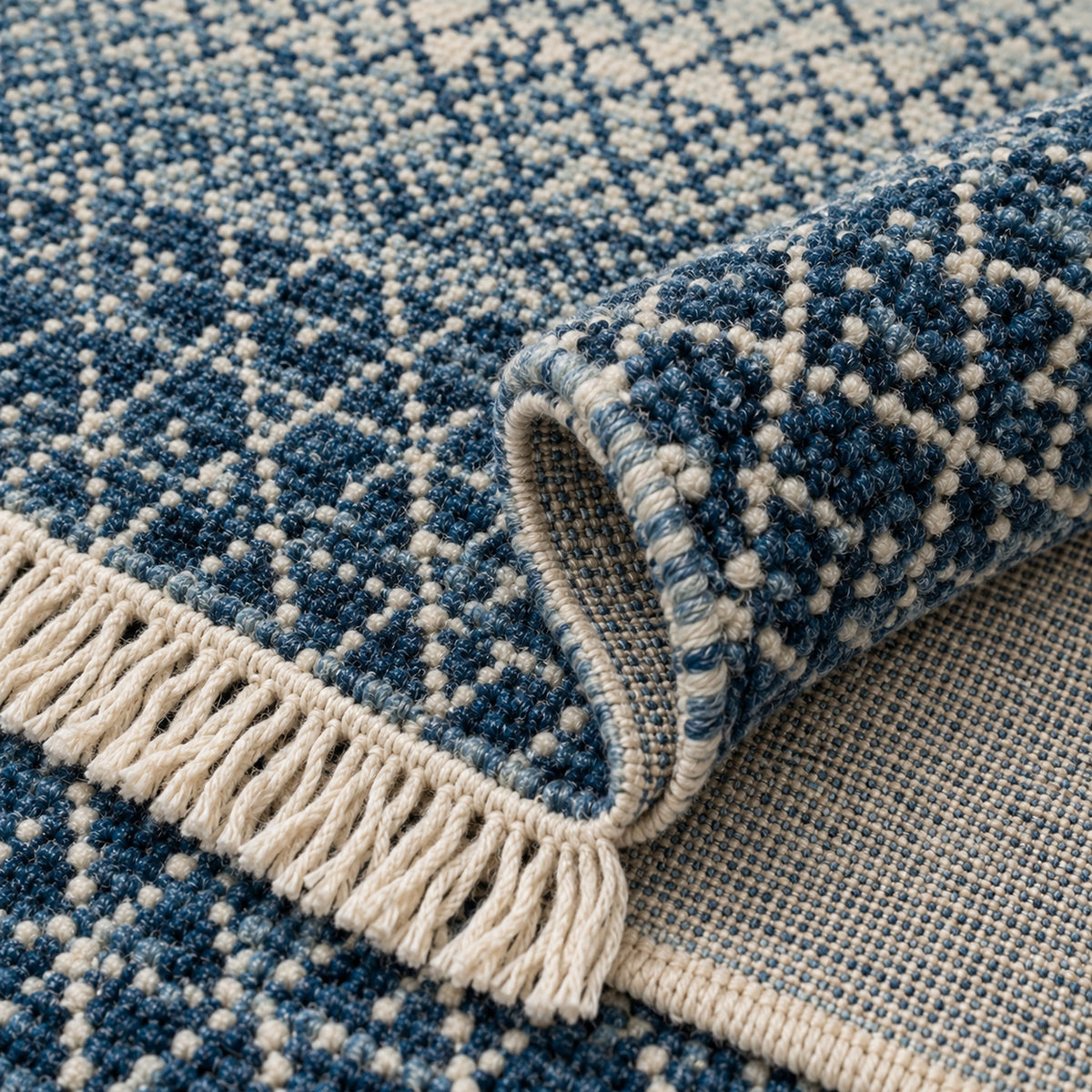 Denim blue Indo Savannah Soft Wool Rug, folded corner showing the back