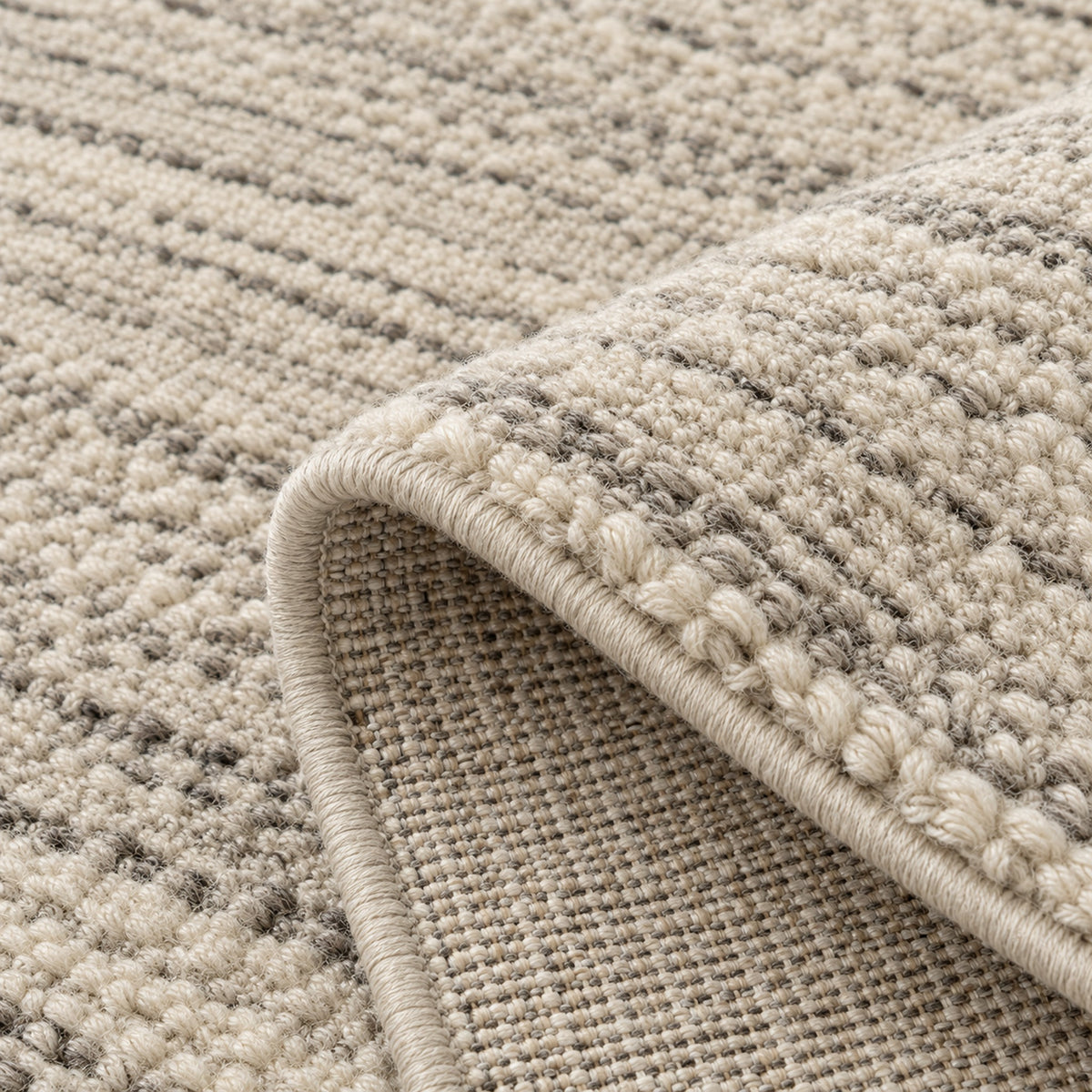 Faded Contemporary rugs, folded corner showing the back