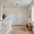 Four-Light Flush Mount Ceiling & Wall Light – Italian Brass Globe Fixture in a room