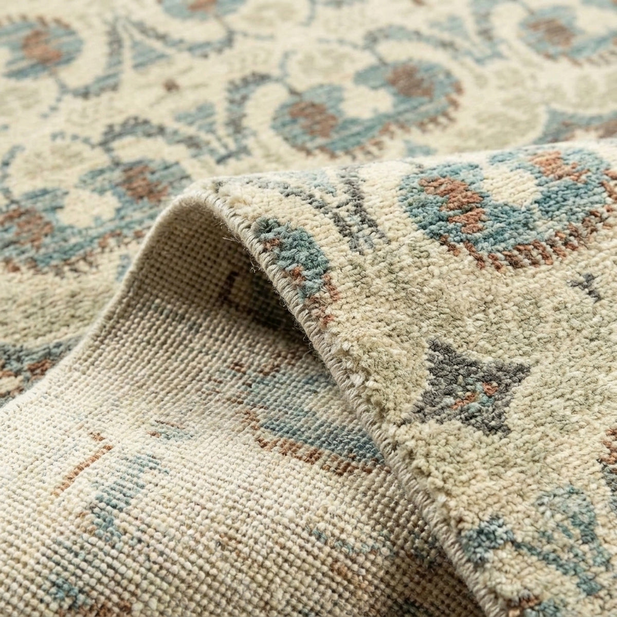 Ikat Traditional Floral Handmade Rug, folded corner showing the back
