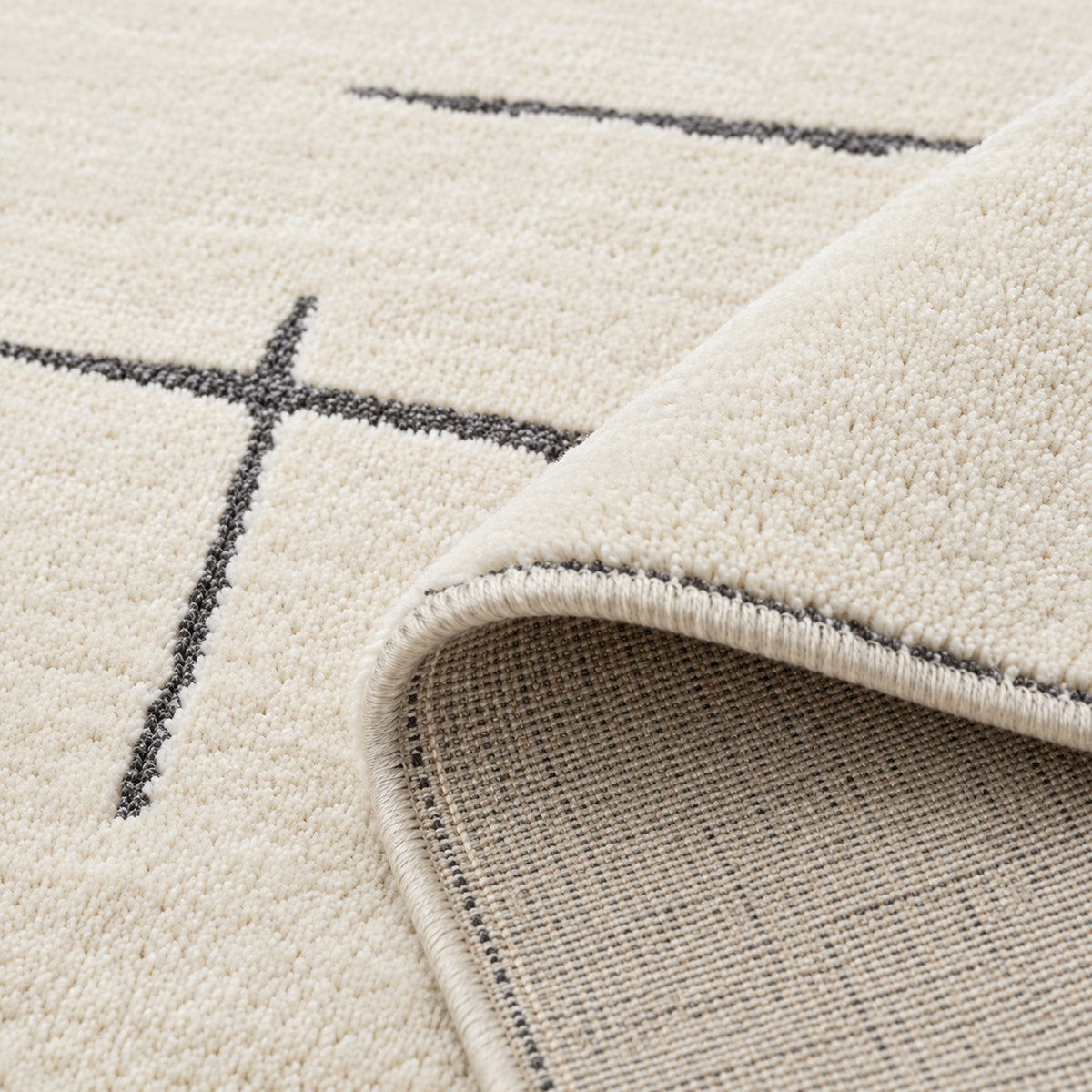 Ivory Stramlined Rug, folded corner showing the back