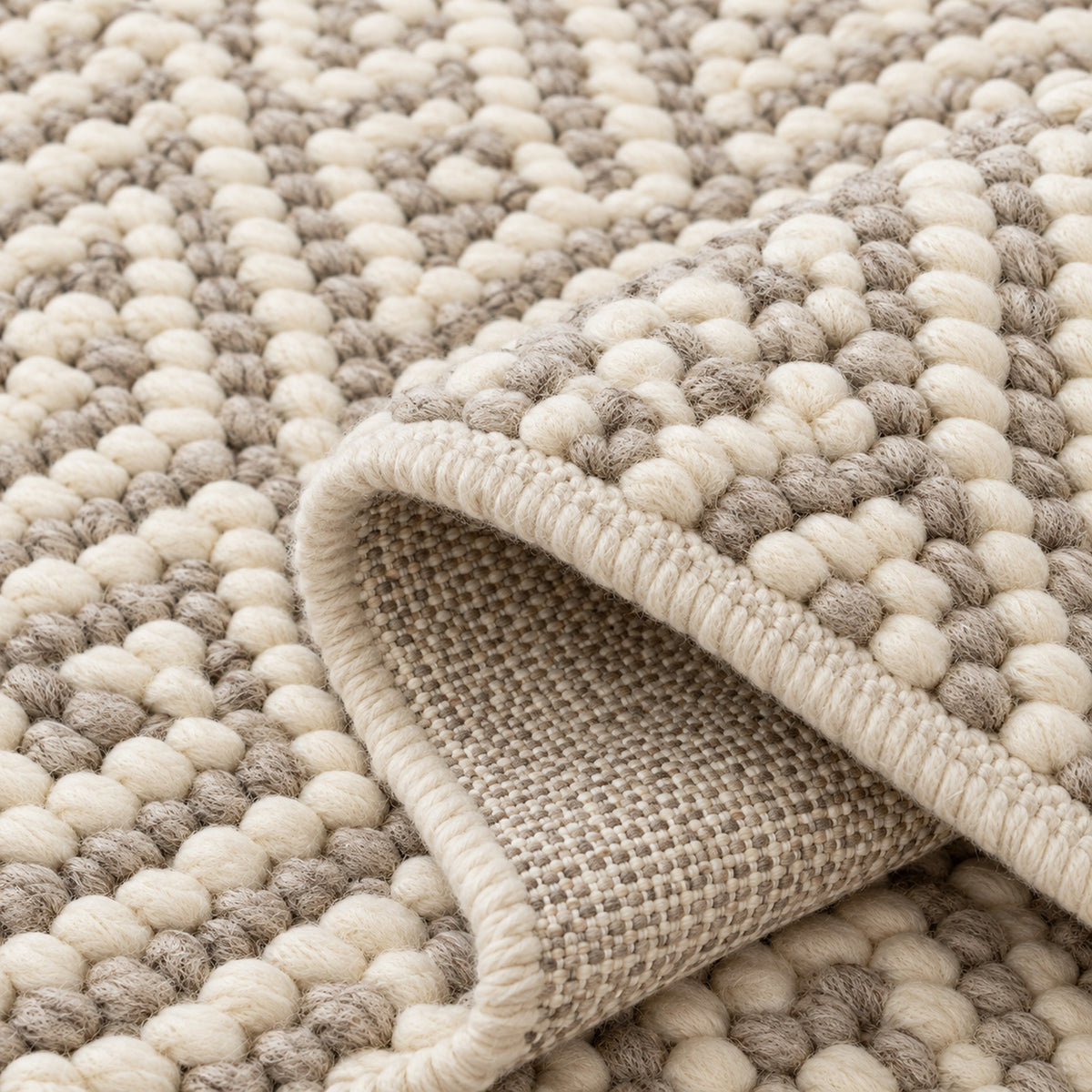 Jute and Cotton Blend Rug - Soft and Versatile Home Decor, folded corner showing the back