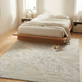 Linear ivory striped rug in a bedroom
