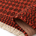 Meteo Soft Wool Hand Knotted Rug, folded corner showing the back