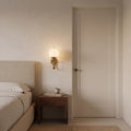 Mid-Century Brass Wall Sconce with Glass Globe in a room