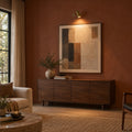 Mid-Century Modern Brass Wall Sconce in a room