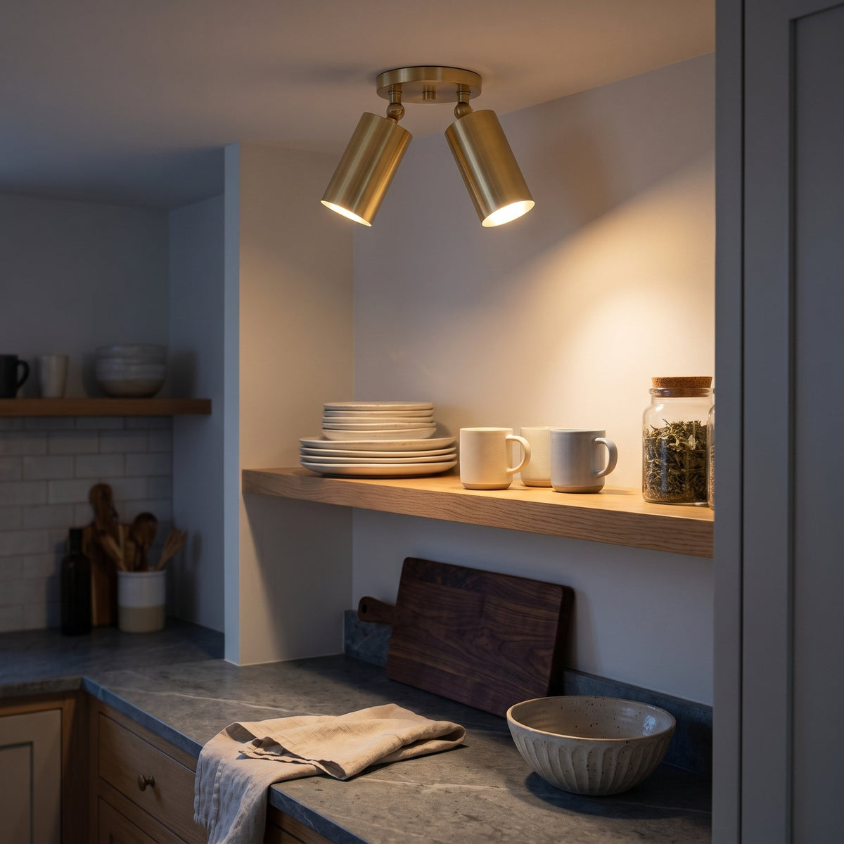 Mid-Century Wall Sconce, 1950s Italian style brass twin-spot light fixture in Polished Brass, ceiling mounted in a kitchen, both heads lighting an open oak shelf and the worktop below