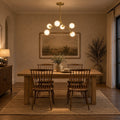 Modern Brass Chandelier with Hand-Blown Opal Glass Shades in a room