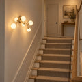 Modern Brass Chandelier with Hand-Blown Opal Glass Shades in a room
