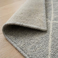 Momeni Handknotted Rug, folded corner showing the back