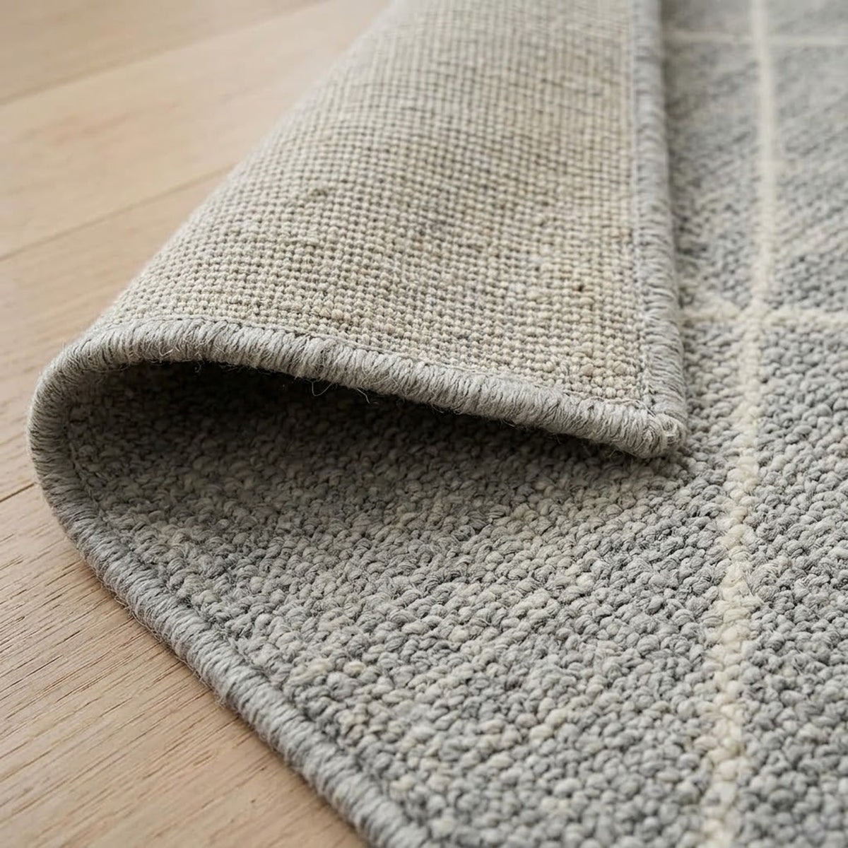 Momeni Handknotted Rug, folded corner showing the back