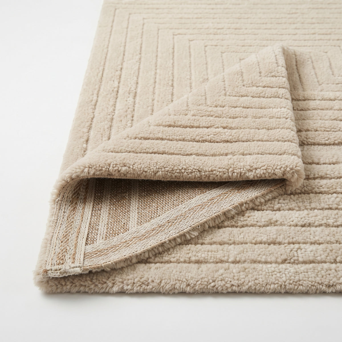 Monochrome Striped Rug, folded corner showing the back