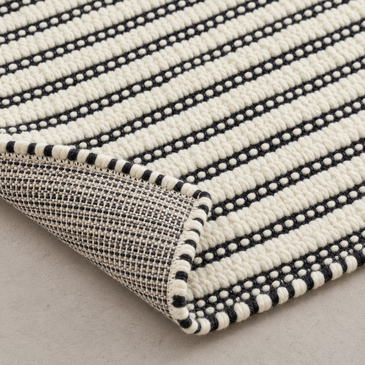 Organic Jute Rug - Bleach Tones for a Cozy Ambiance, folded corner showing the back