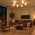 Six-Light Modern Stilnovo Ceiling Lamp – Handcrafted Raw Brass in a room