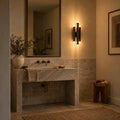 Six-Light Wall Fixture – Antique Brass in a room