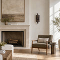 Six-Light Wall Fixture – Antique Brass in a room