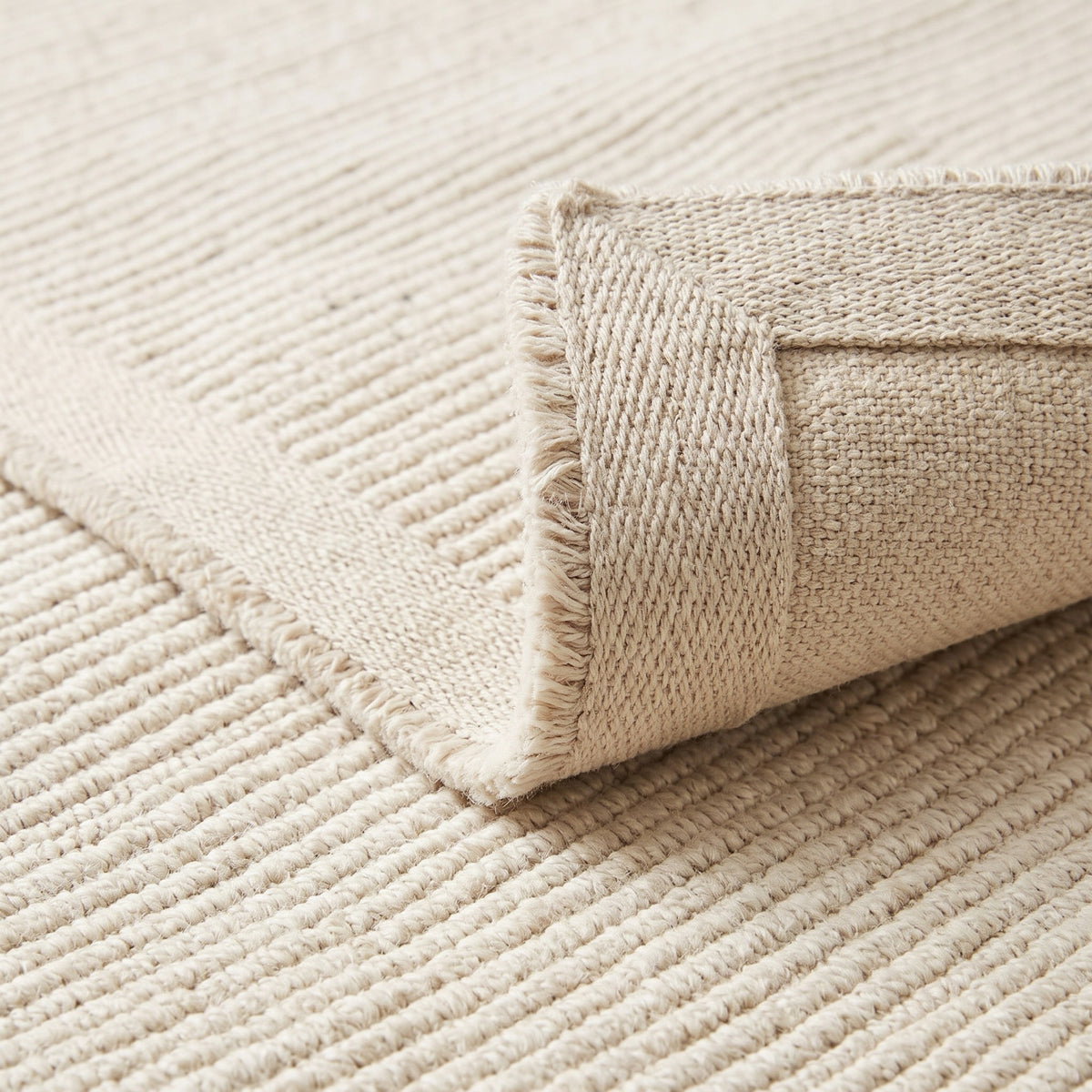 Solid Ivory Ribbed, folded corner showing the back