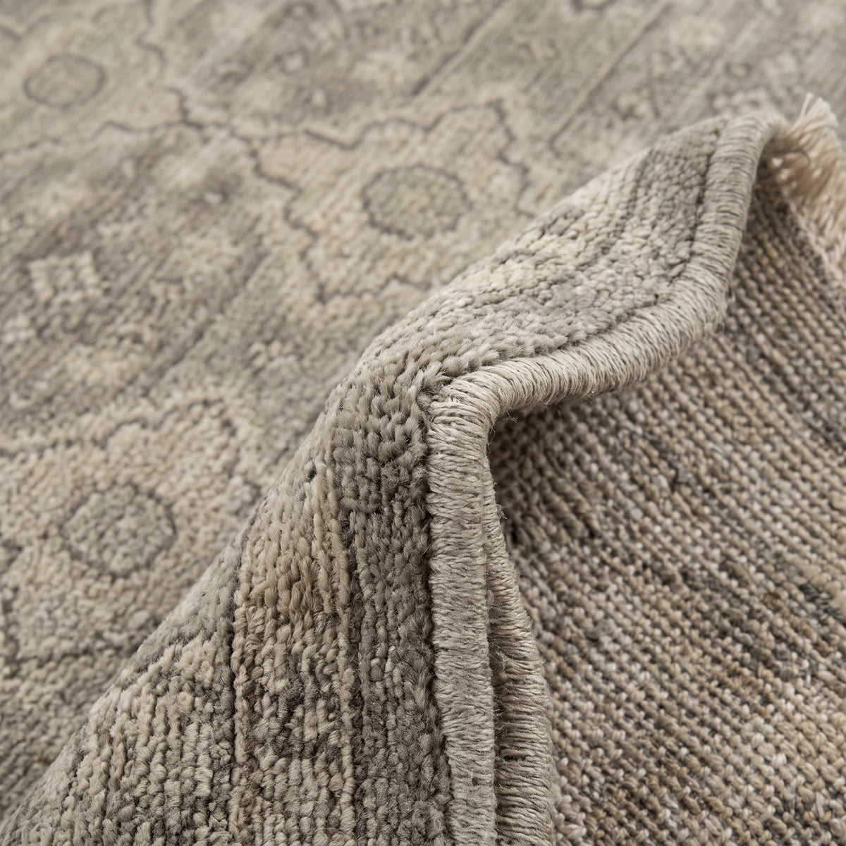 Taupe Floral Gray Trbal Turkish Muted Look Rug, folded corner showing the back