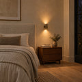 Two-Light Mid-Century Brass Wall Sconce in a room