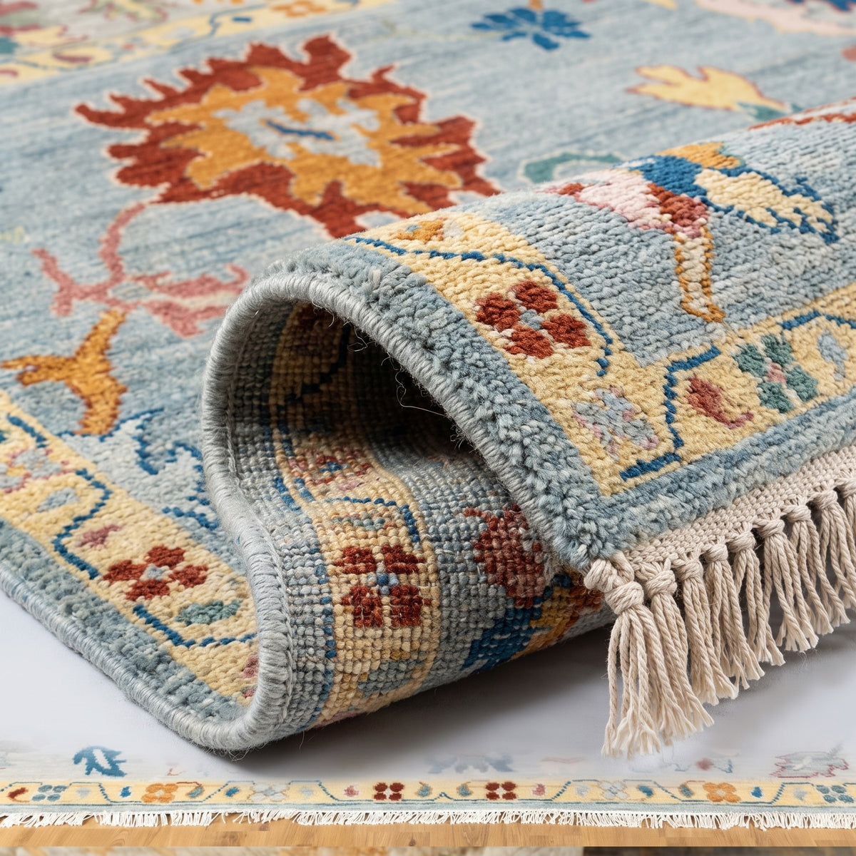 Unique Hand-Knotted Oushak Rug, folded corner showing the back