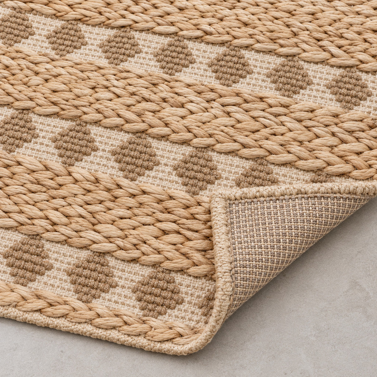 Vintage-Inspired Jute Rug - Authentic, Handcrafted Beauty, folded corner showing the back