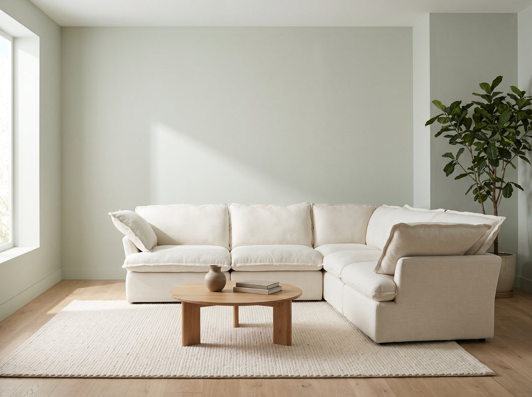 Cream linen cloud sectional in a sage living room