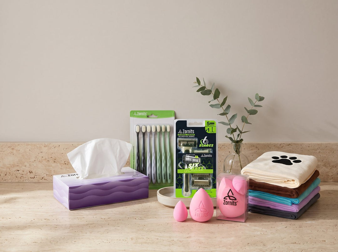 Zornits tissues, toothbrushes, razor, sponges and dog towels on a bathroom counter