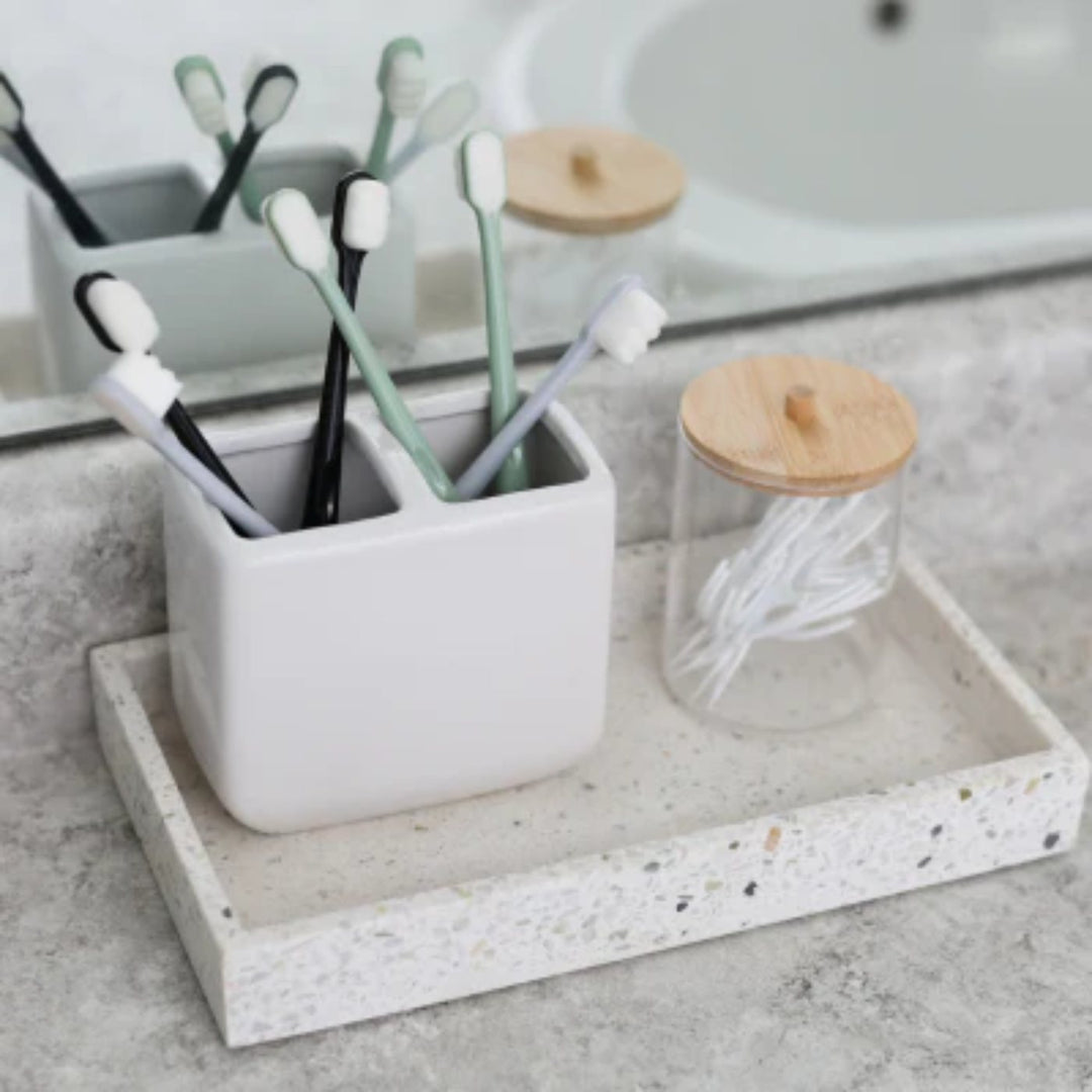 Zornits soft toothbrushes in a holder on a terrazzo counter